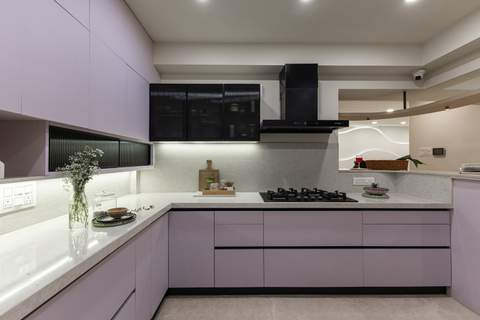 Contemporary purple kitchen with sleek cabinetry and modern appliances.