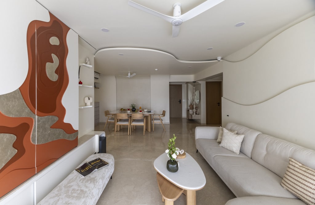 Interior of a stylish, modern living room with neutral tones and contemporary furniture.